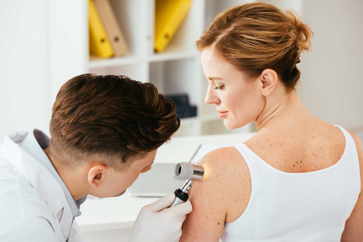 Stock image of doctor testing woman of her shoulder