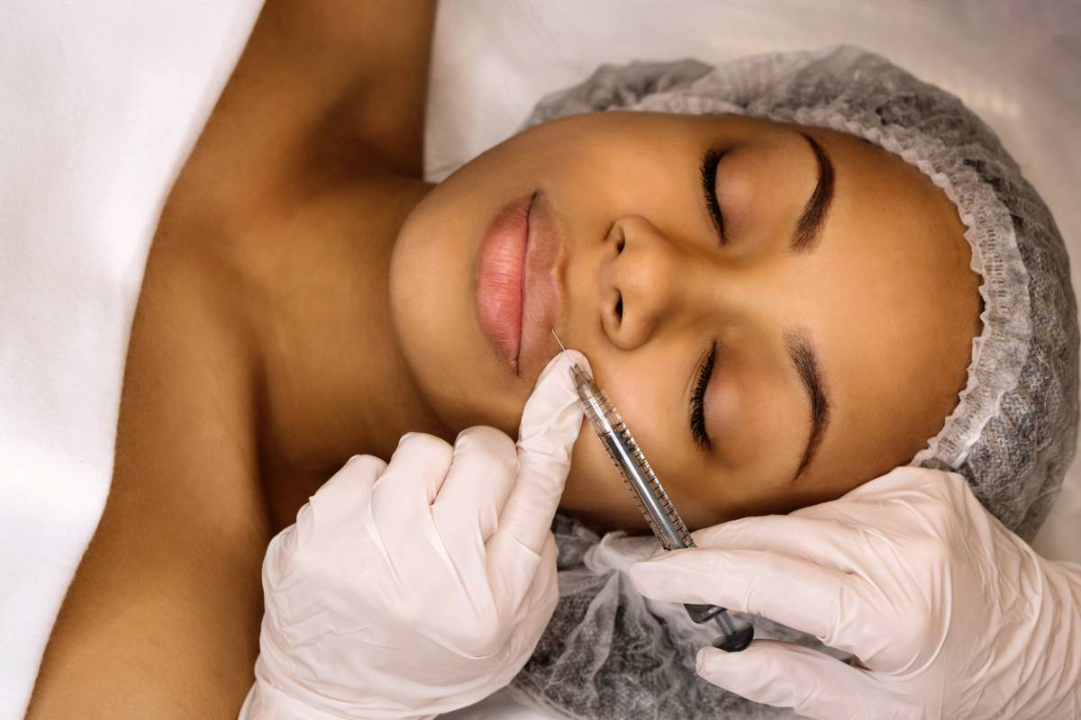 Stock image of woman getting botox or dermal fillers treatment